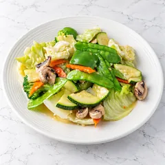 Sautéed garden vegetables: cabbage, zucchini, snow peas, carrot, mushroom and broccoli in light sauce