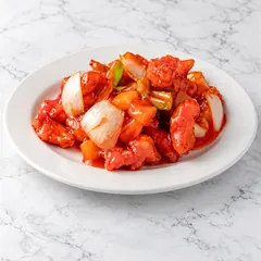 Sweet and sour chicken with onion, pineapple and green pepper